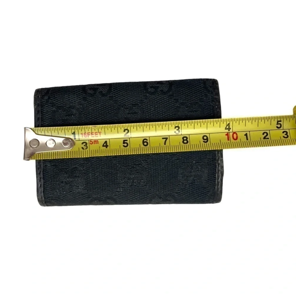 Gucci black signature canvas leather key holder